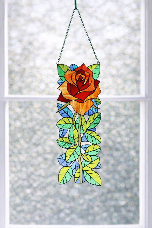 Stained glass rose hanging on a window